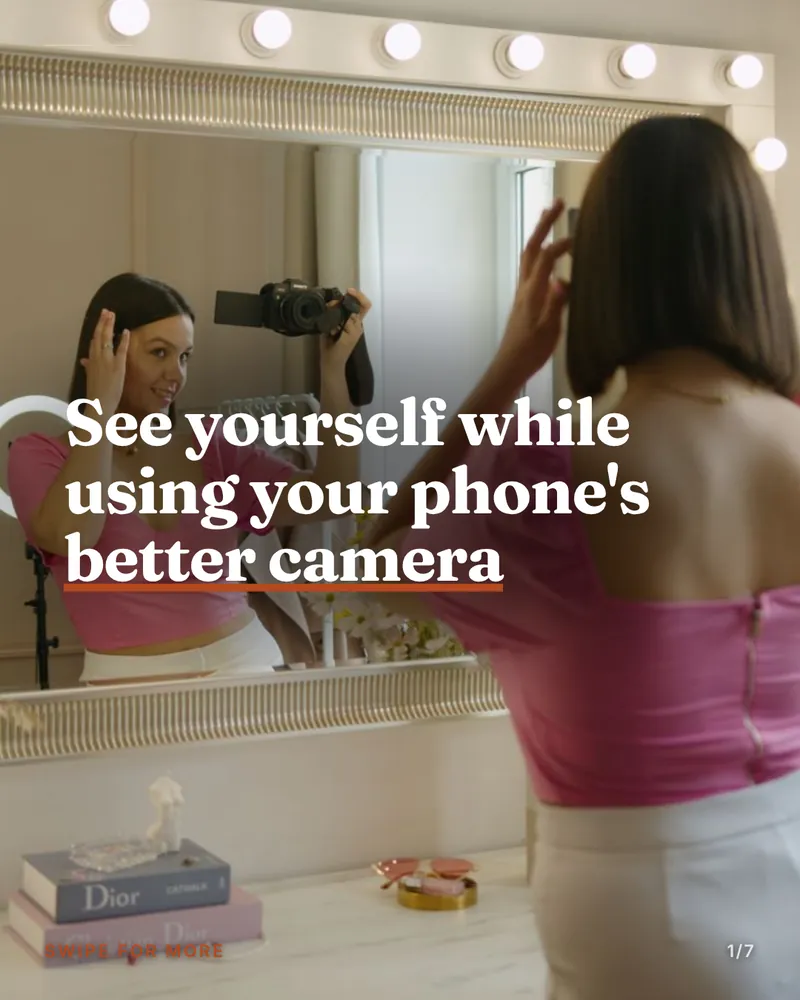 An Editorial carousel cover: a serif headline reading “See yourself while using your phone’s better camera” over a photograph of someone filming at a lit vanity mirror.